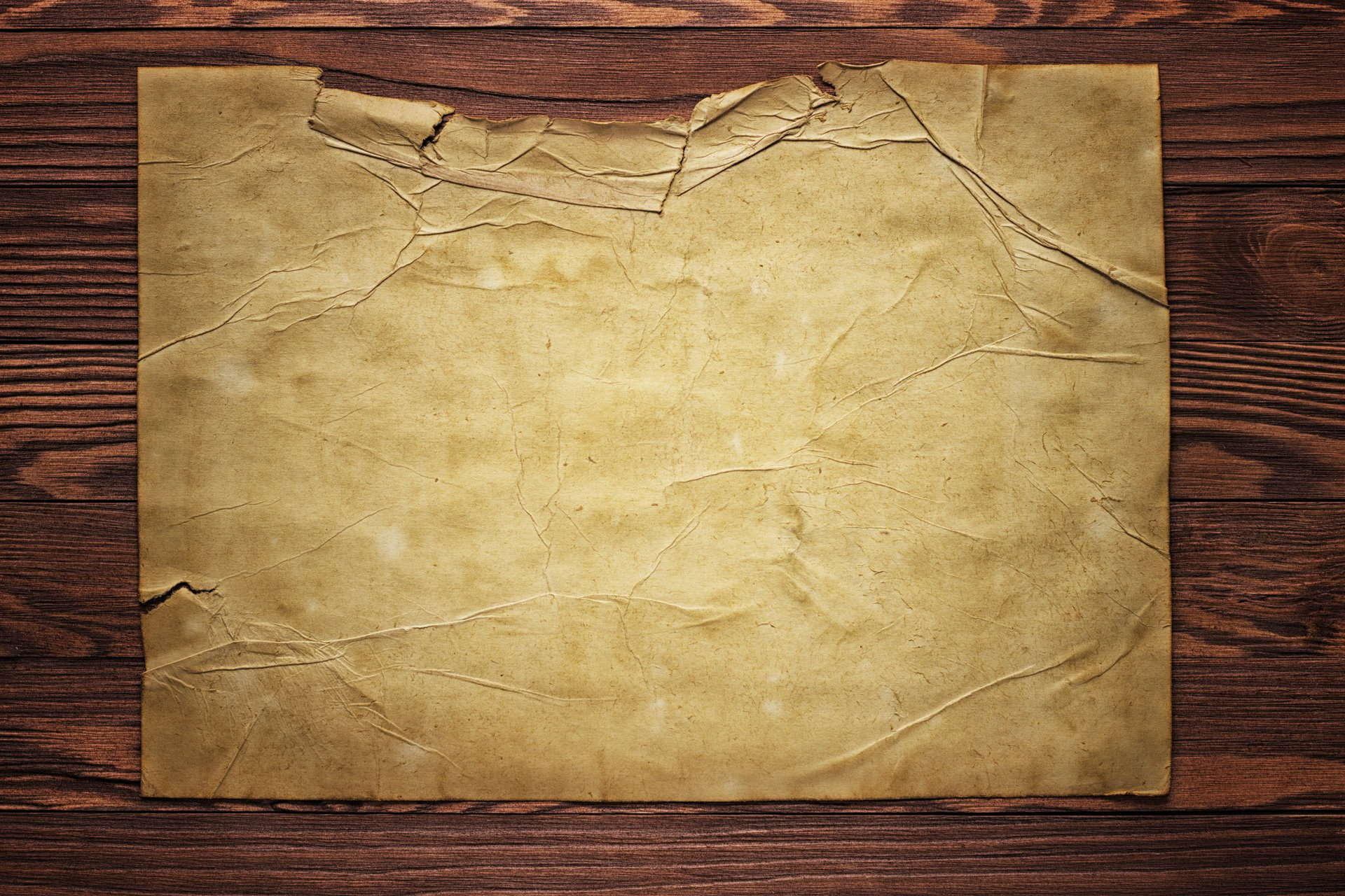 Piece of old paper on wood texture background